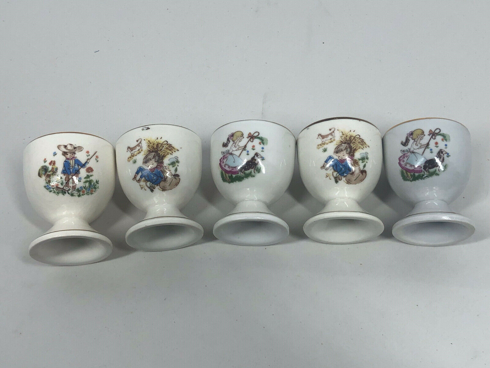 Vintage Lot Of 5 Nursery Rhyme Porcelain Egg Cups Gold Trim